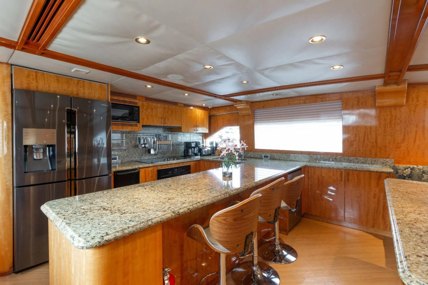 a kitchen with a large island aboard CARPE DIEM Yacht for Charter