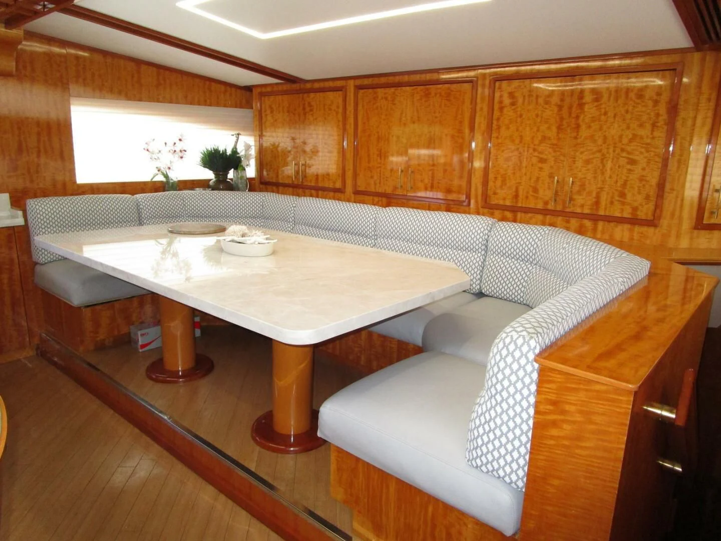 a room with a table and chairs aboard CARPE DIEM Yacht for Charter