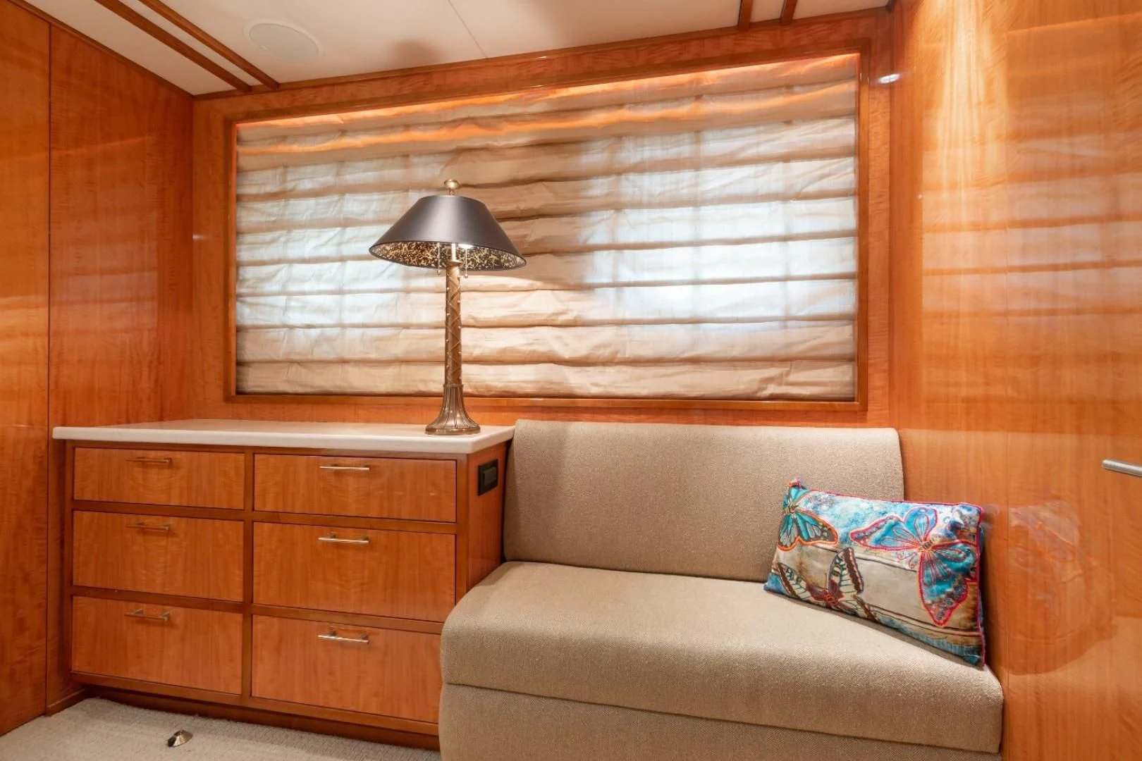a living room with a couch and a lamp aboard CARPE DIEM Yacht for Charter