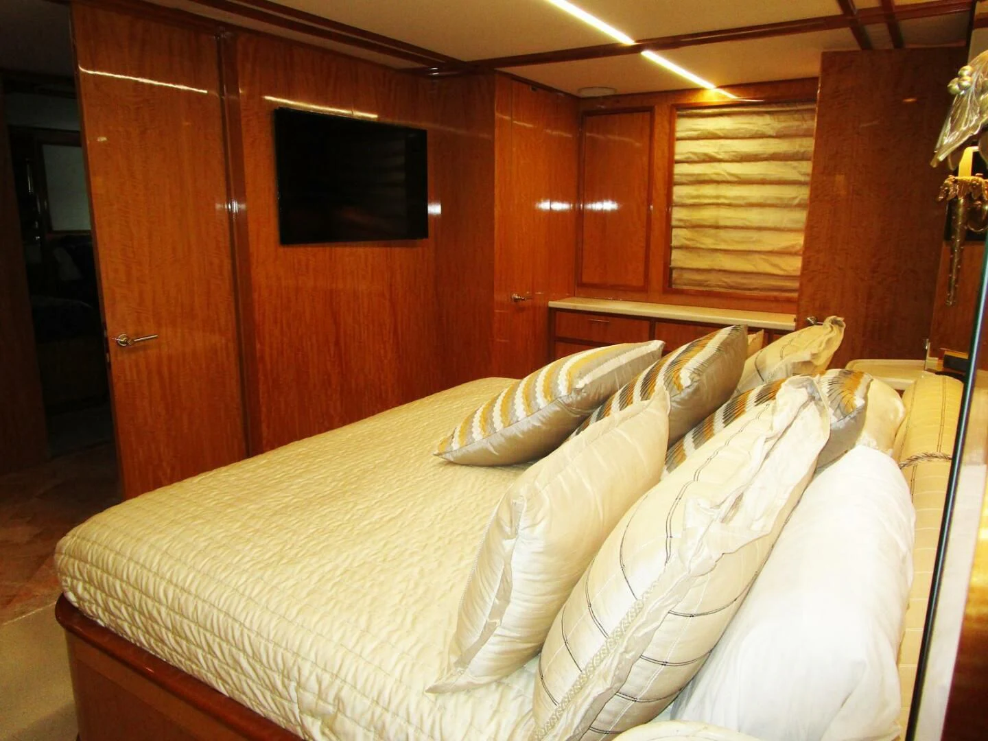 a bed with white sheets aboard CARPE DIEM Yacht for Charter
