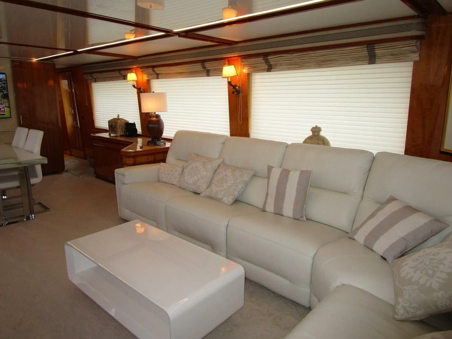 a living room with a couch and a table aboard CARPE DIEM Yacht for Charter