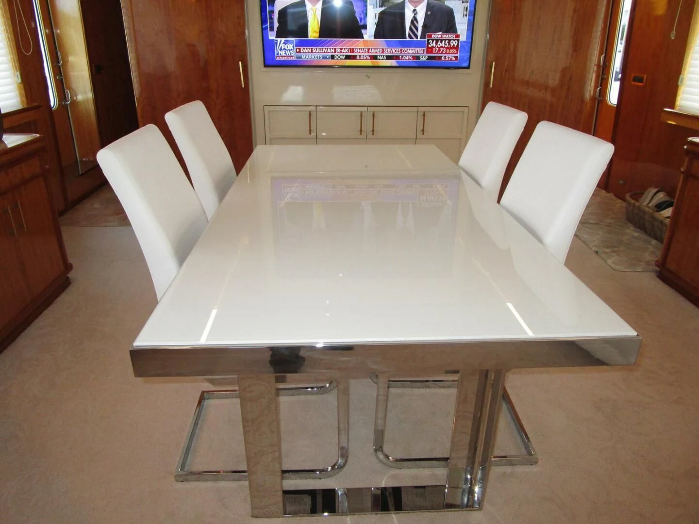 a table with chairs around it aboard CARPE DIEM Yacht for Charter