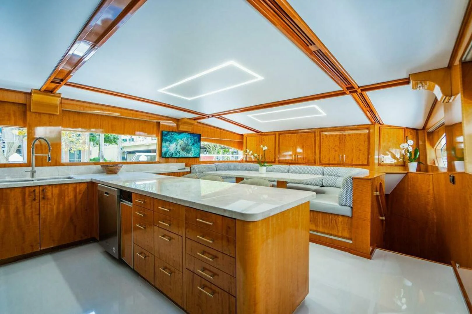 a large kitchen with wooden cabinets aboard CARPE DIEM Yacht for Charter