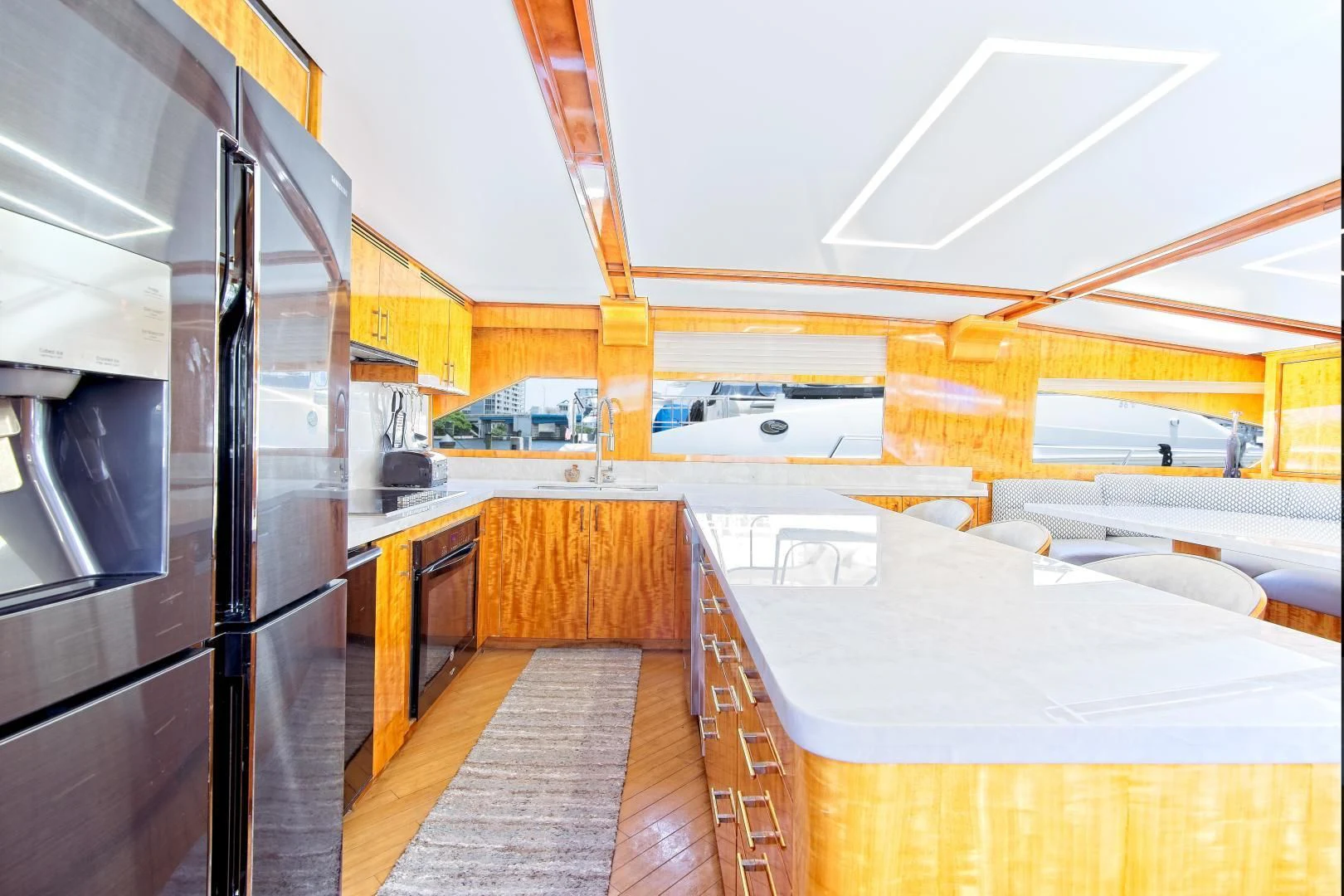a room with a large table and chairs aboard CARPE DIEM Yacht for Charter