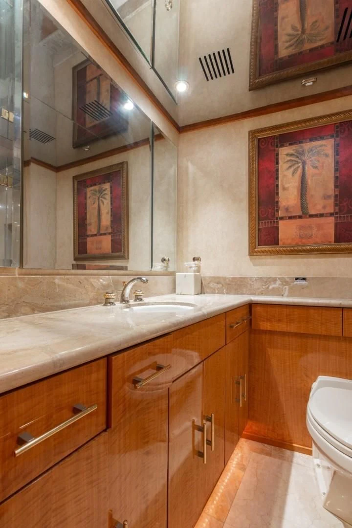 a bathroom with a sink and a mirror aboard CARPE DIEM Yacht for Charter