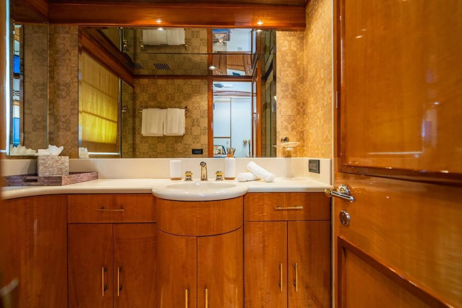 a bathroom with a sink and cabinets aboard CARPE DIEM Yacht for Charter