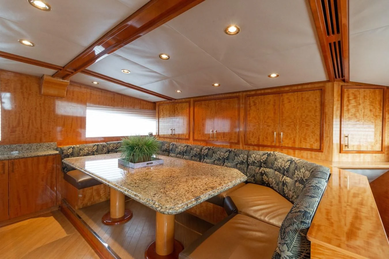 a living room with a table and couches aboard CARPE DIEM Yacht for Charter