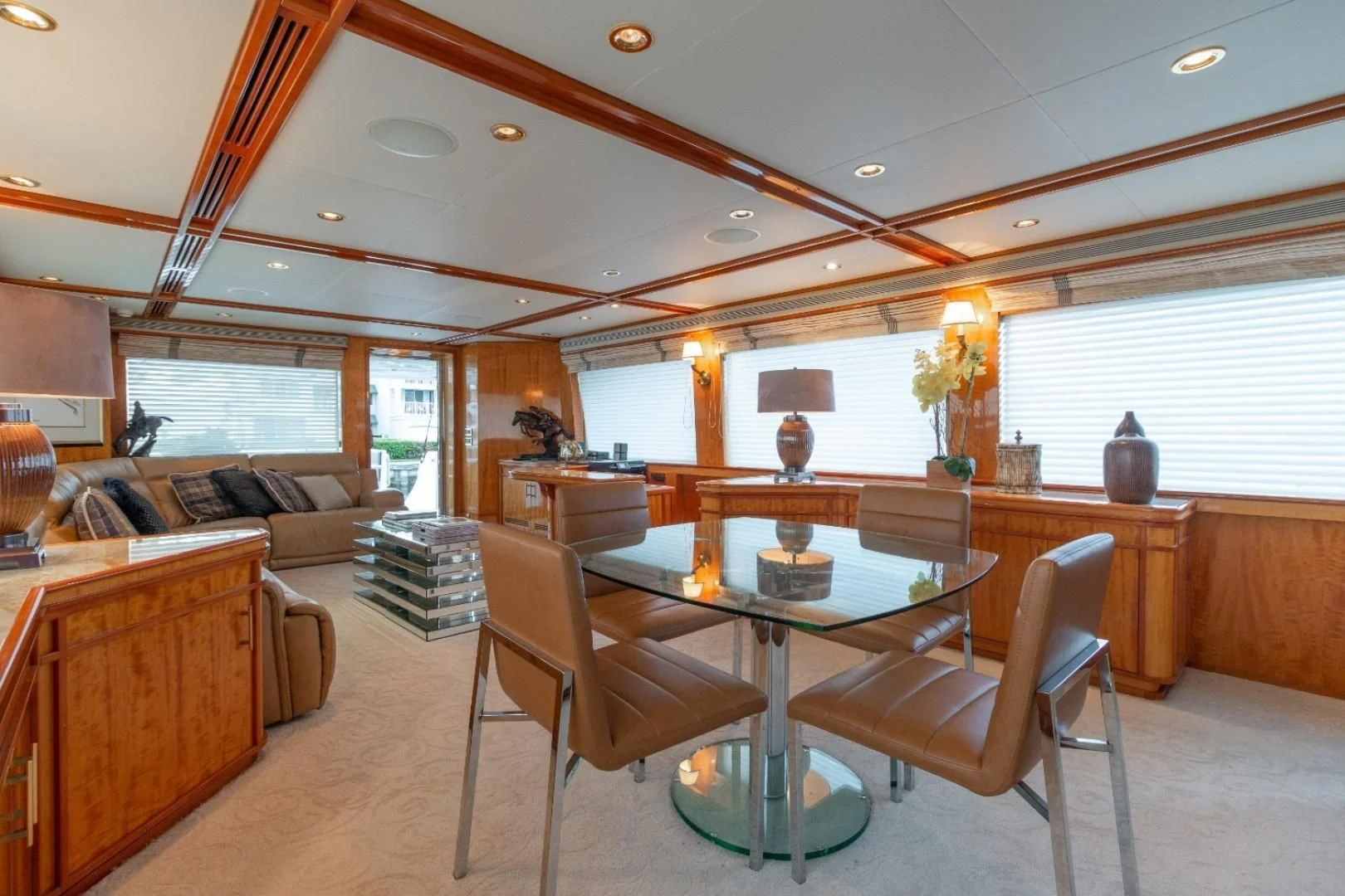 a living room with a table and chairs aboard CARPE DIEM Yacht for Charter