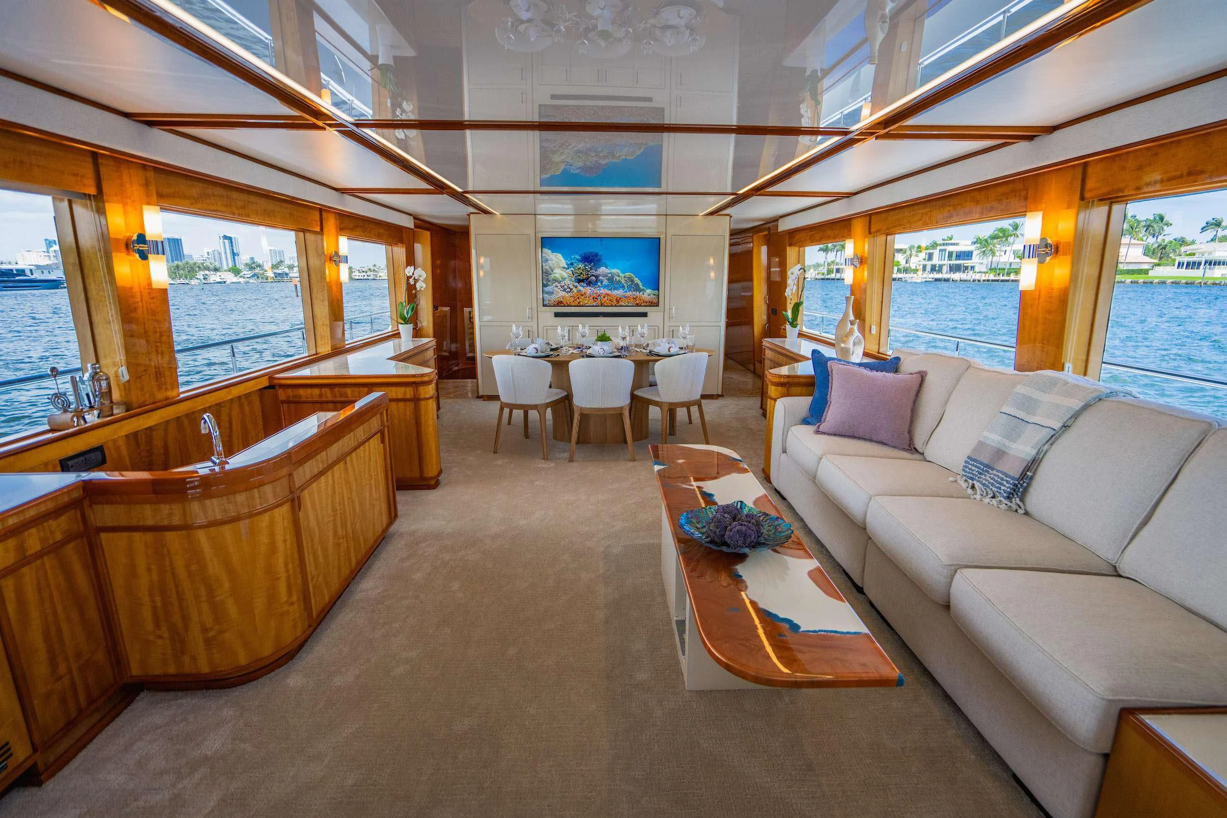 a living room with a large window aboard CARPE DIEM Yacht for Charter