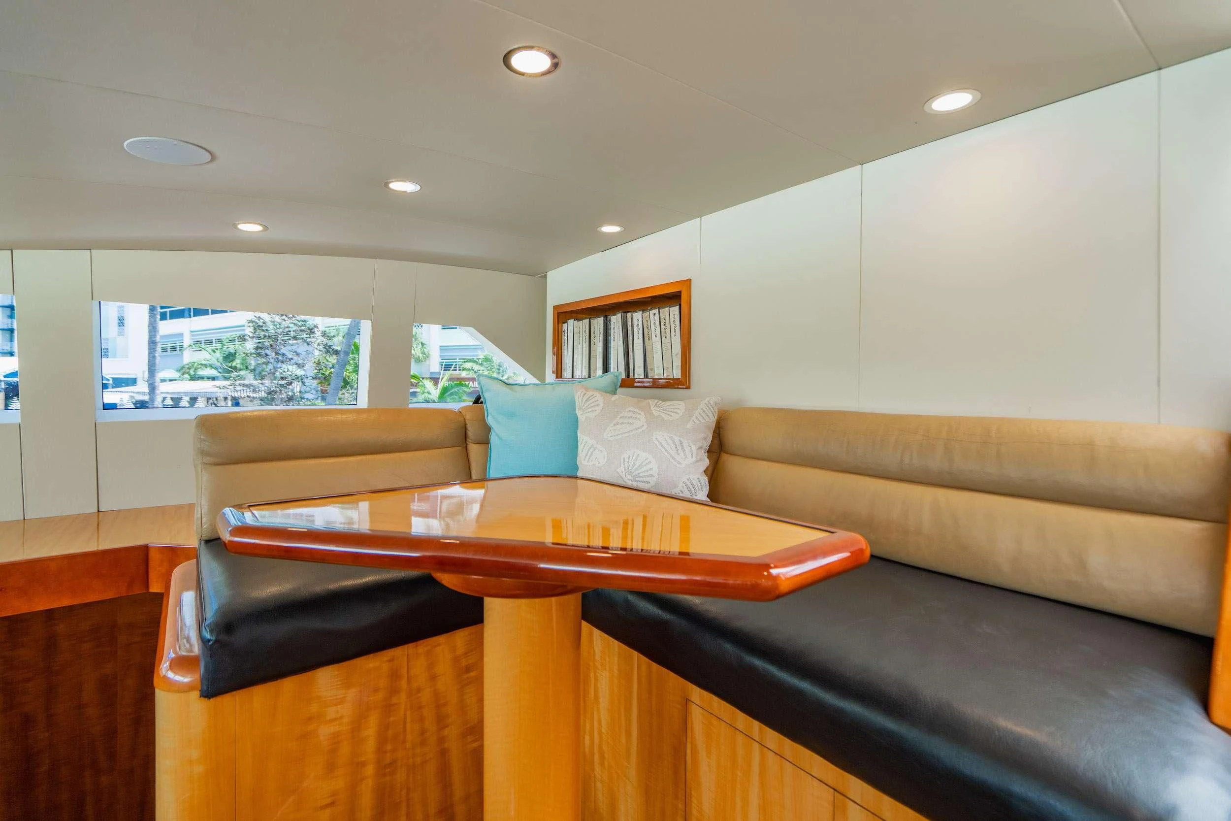 a living room with a couch and a table aboard CARPE DIEM Yacht for Charter