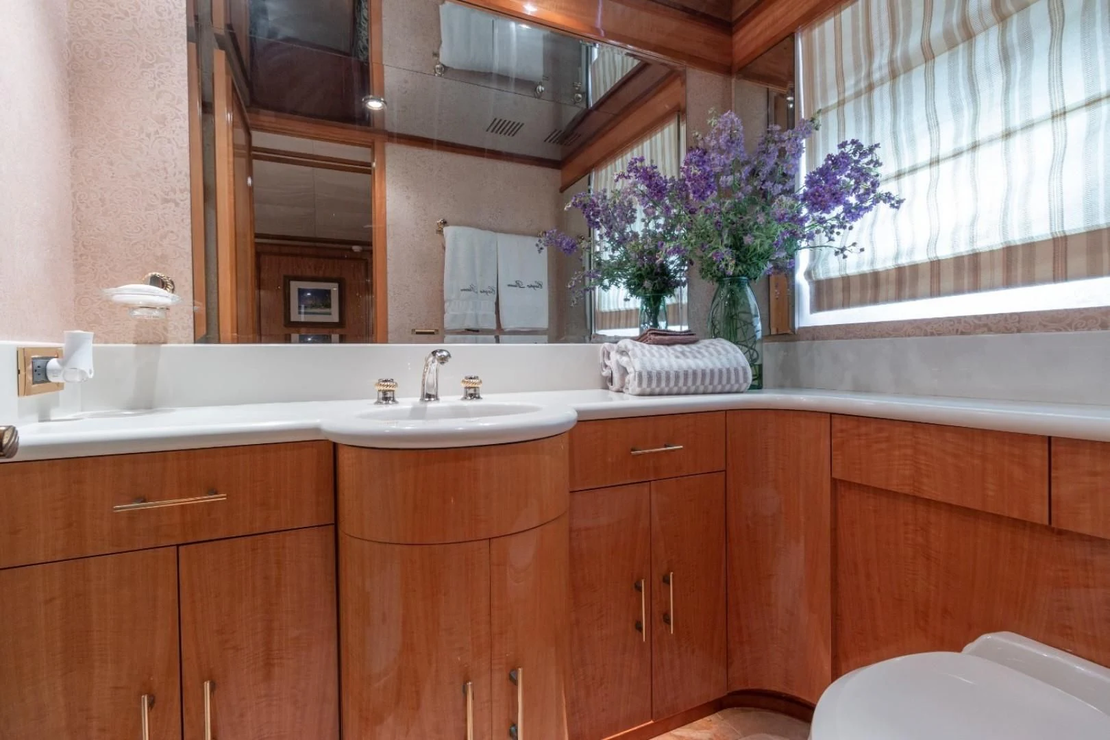 a bathroom with a large mirror aboard CARPE DIEM Yacht for Charter