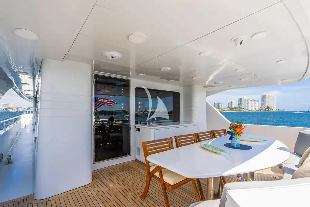 a room with a table and chairs aboard CARPE DIEM Yacht for Charter