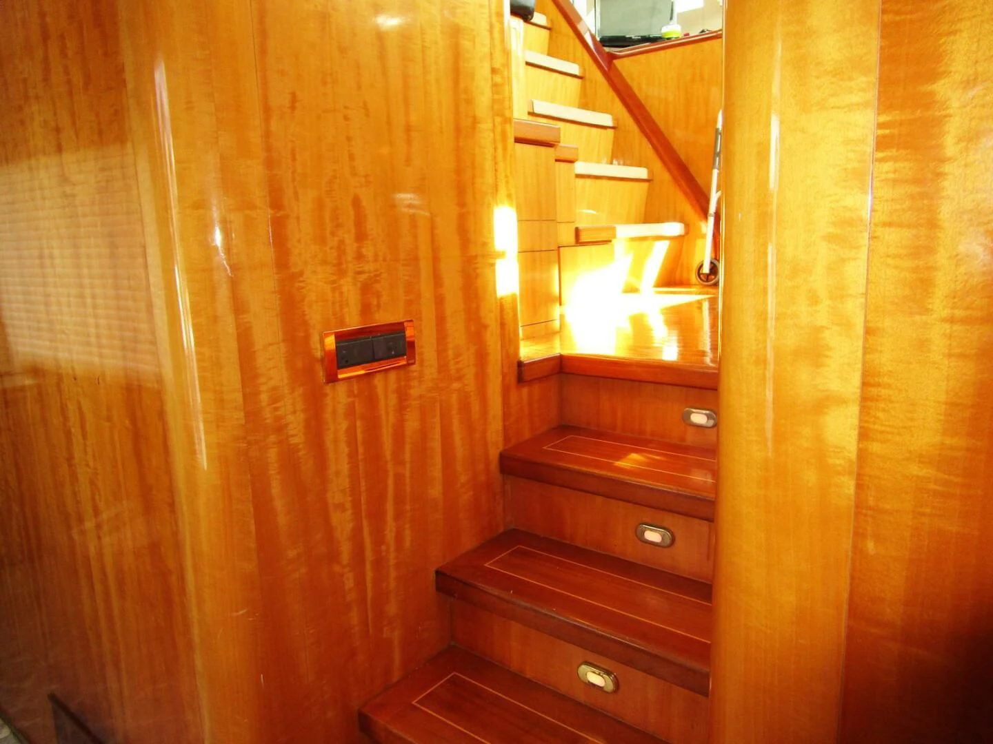 a wooden door with a light on it aboard CARPE DIEM Yacht for Charter