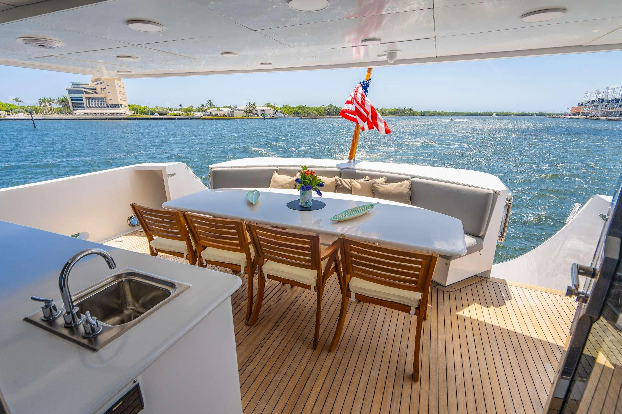 a table and chairs on a deck aboard CARPE DIEM Yacht for Charter