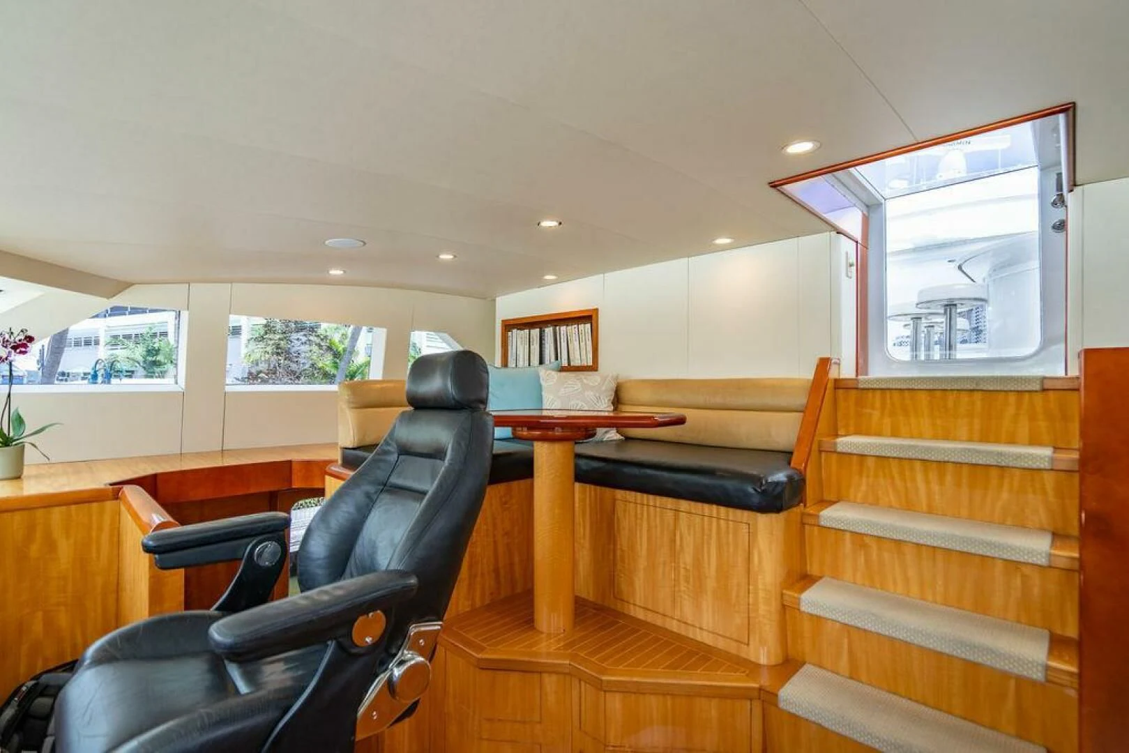 a room with a desk and chairs aboard CARPE DIEM Yacht for Charter