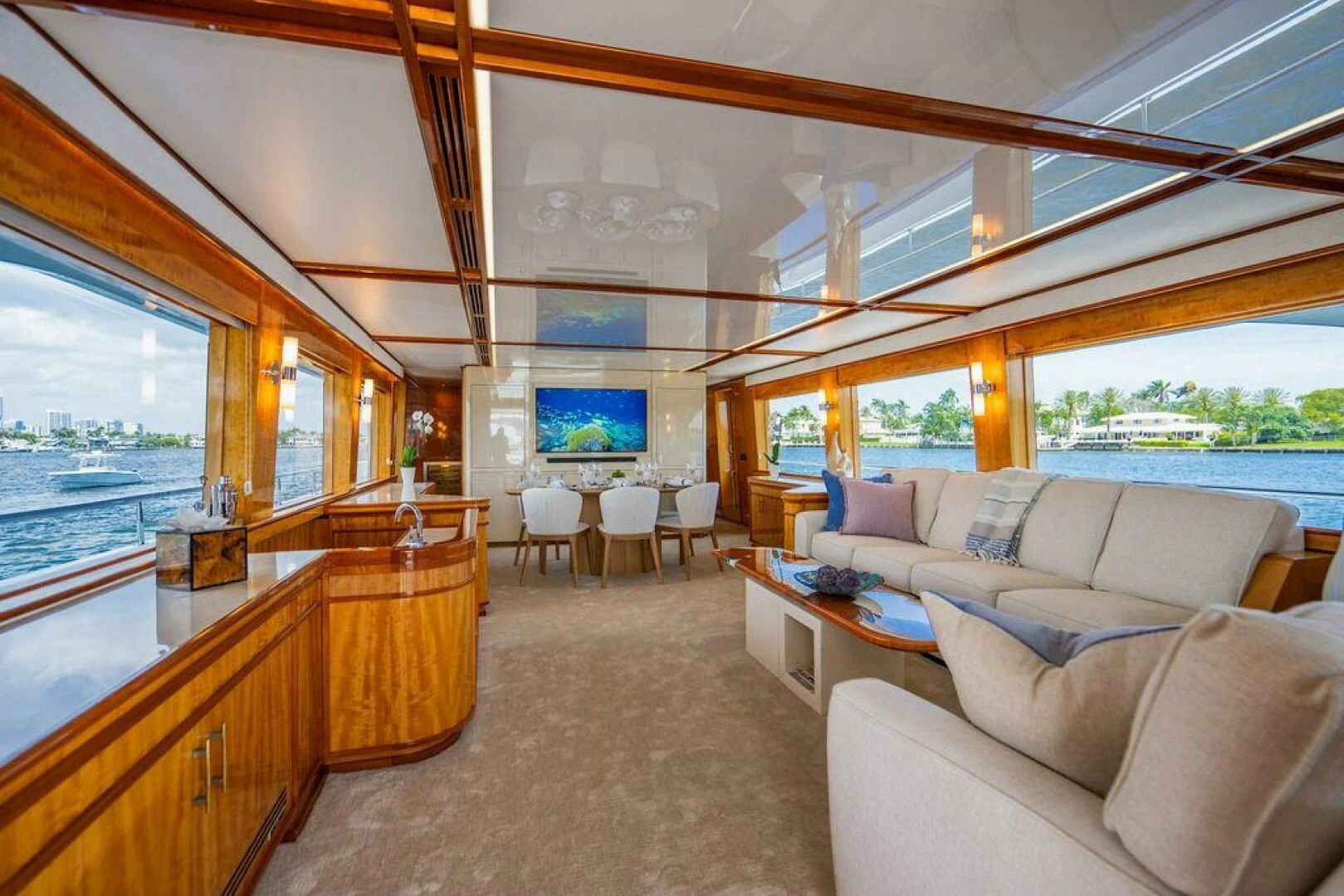 a living room with a large window aboard CARPE DIEM Yacht for Charter