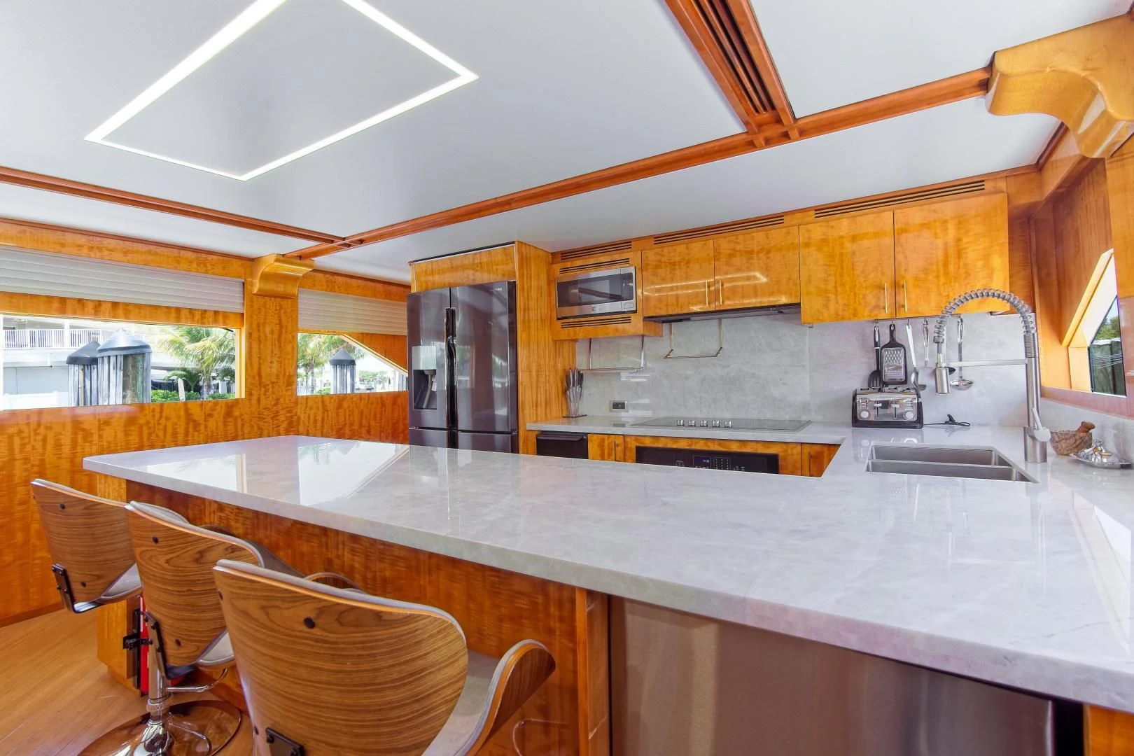 a kitchen with a large island aboard CARPE DIEM Yacht for Charter