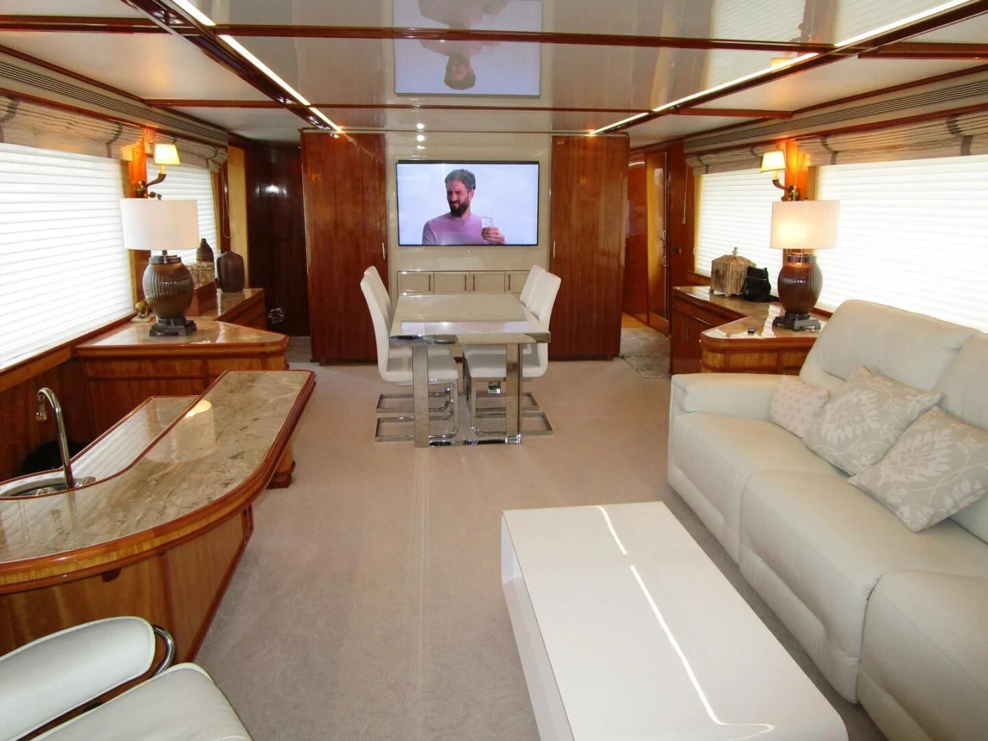 a living room with a large television aboard CARPE DIEM Yacht for Charter
