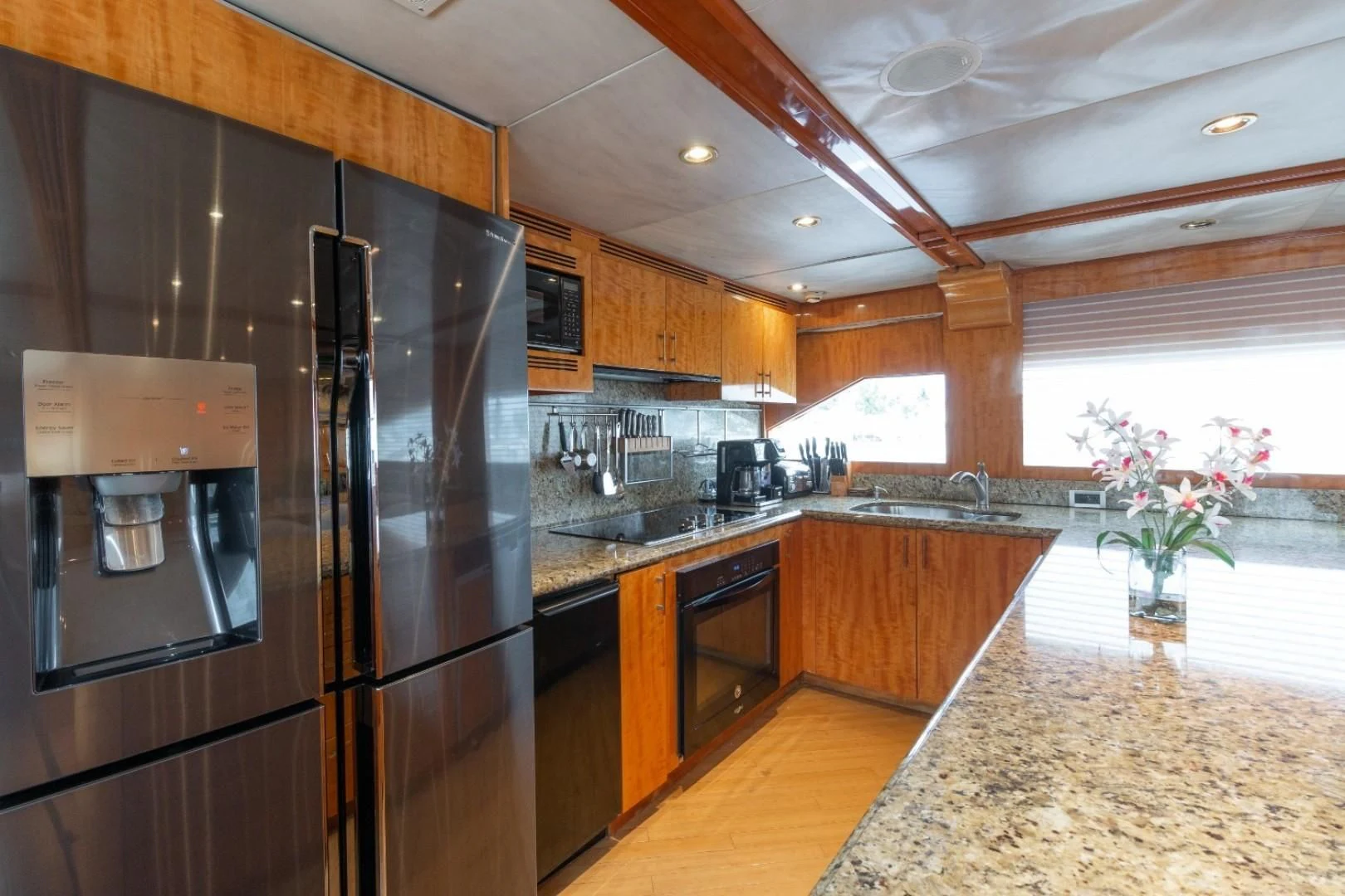 a kitchen with a large refrigerator aboard CARPE DIEM Yacht for Charter