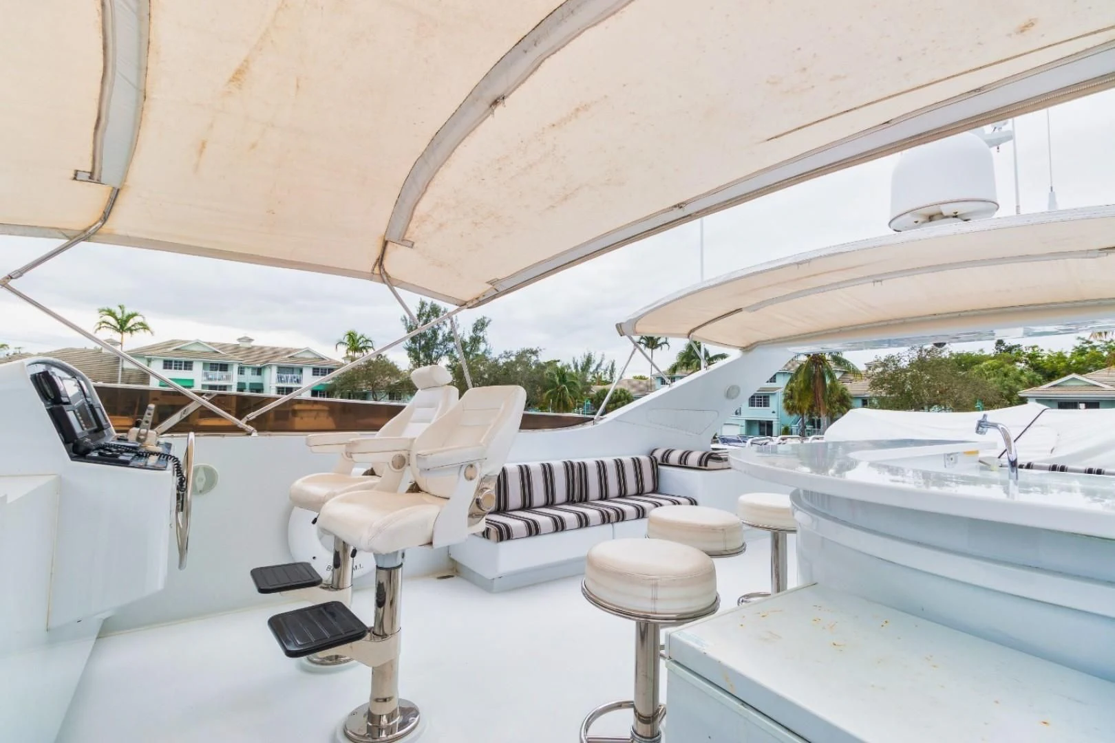 a white piano on a white surface aboard CARPE DIEM Yacht for Charter