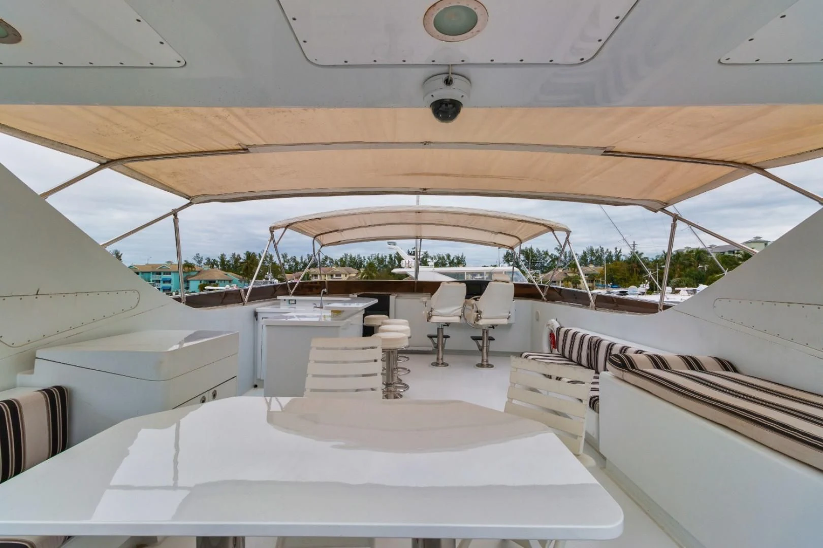 a room with white tables and chairs aboard CARPE DIEM Yacht for Charter