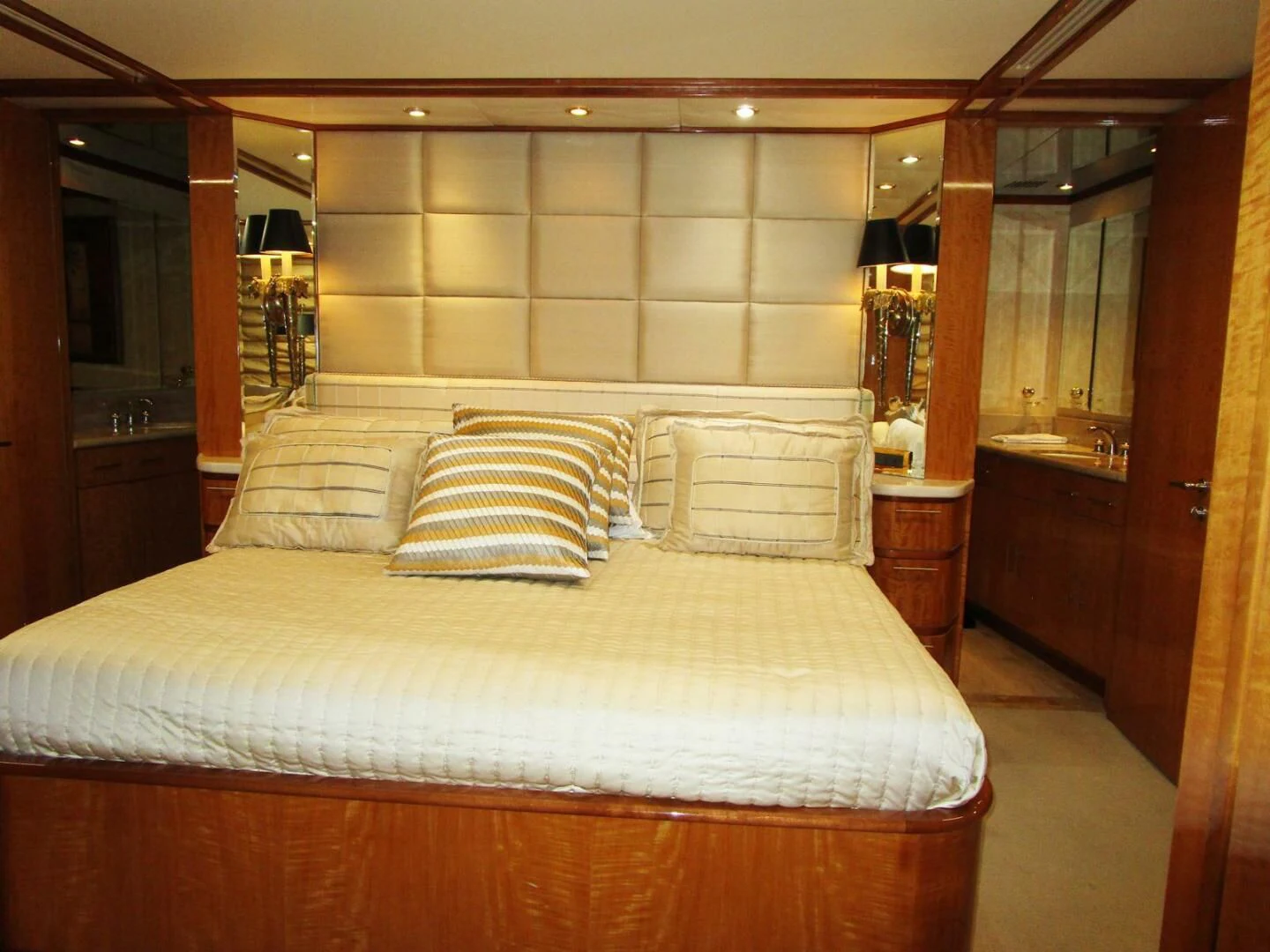 a bed with white sheets aboard CARPE DIEM Yacht for Charter