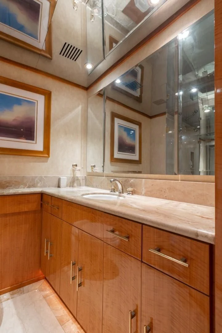 a bathroom with a large mirror aboard CARPE DIEM Yacht for Charter
