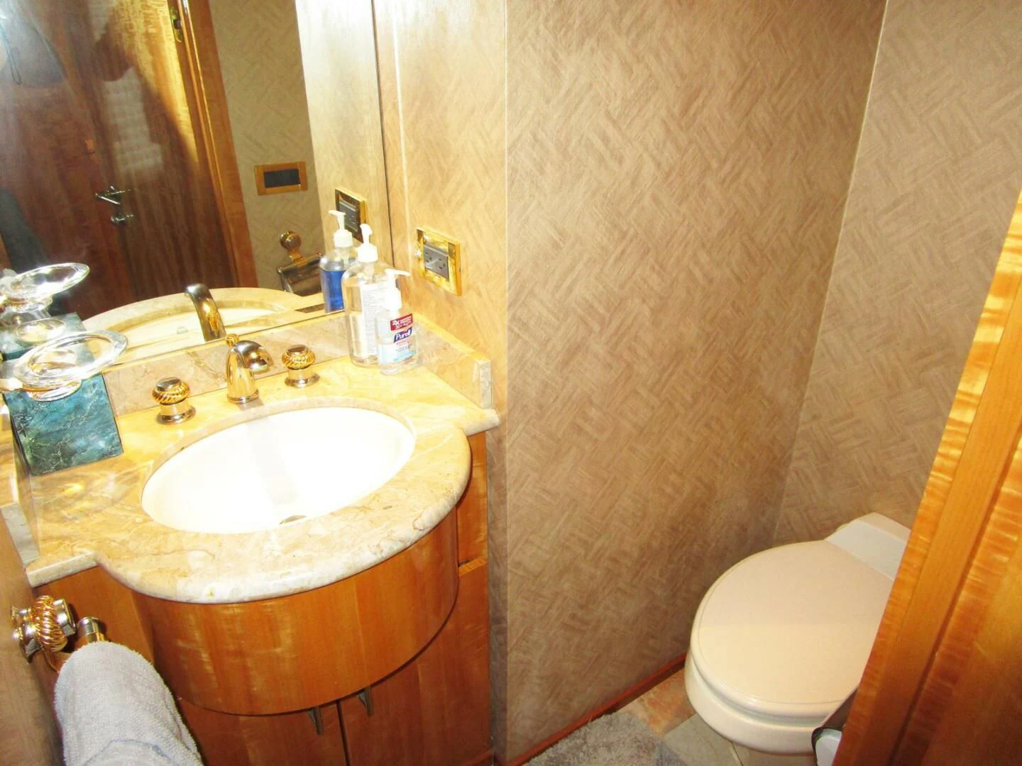 a bathroom with a sink and toilet aboard CARPE DIEM Yacht for Charter