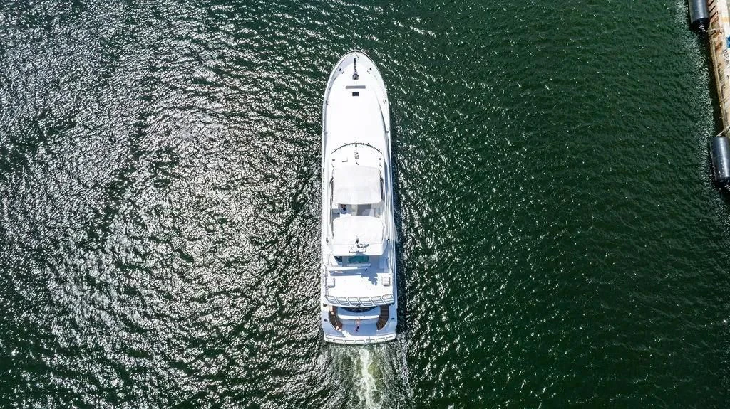 a white car on a road aboard CARPE DIEM Yacht for Charter