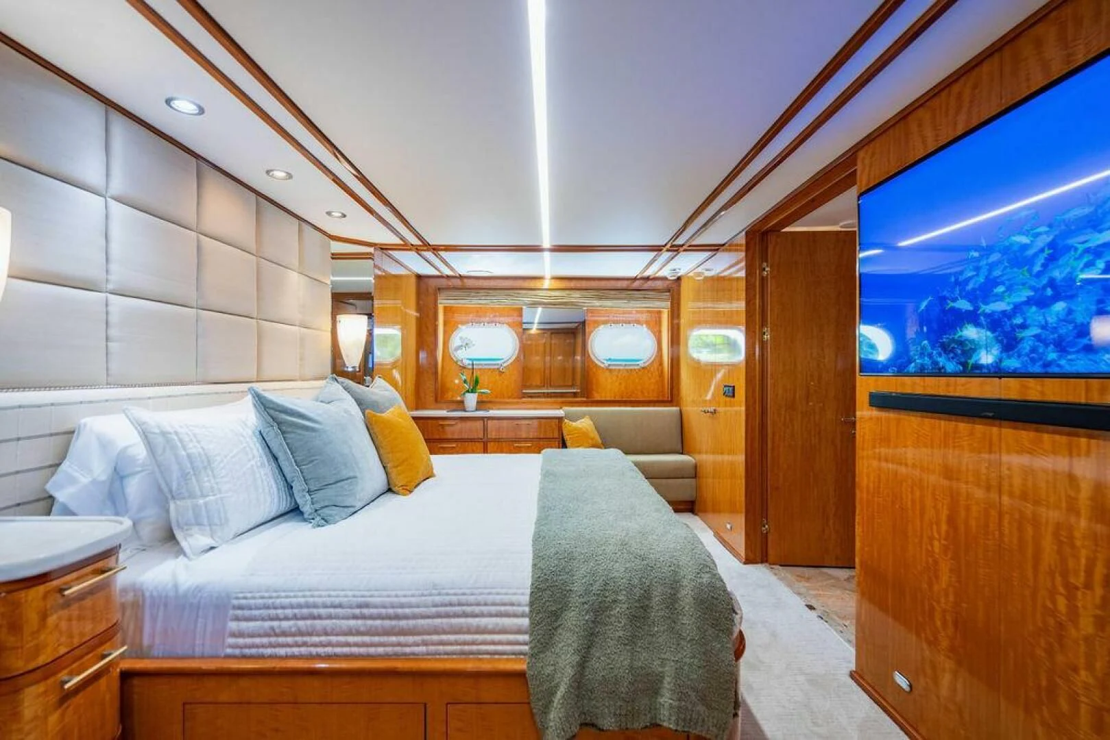 a room with a bed and a window aboard CARPE DIEM Yacht for Charter