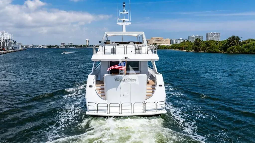a white boat on the water aboard CARPE DIEM Yacht for Charter