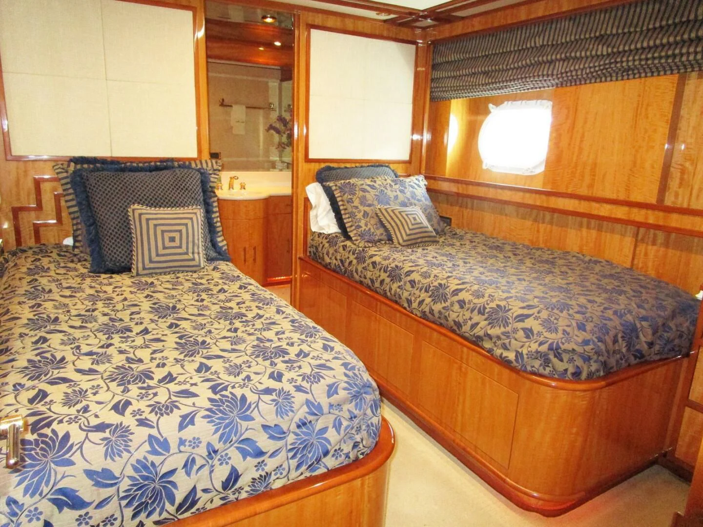 a couple of beds in a room aboard CARPE DIEM Yacht for Charter