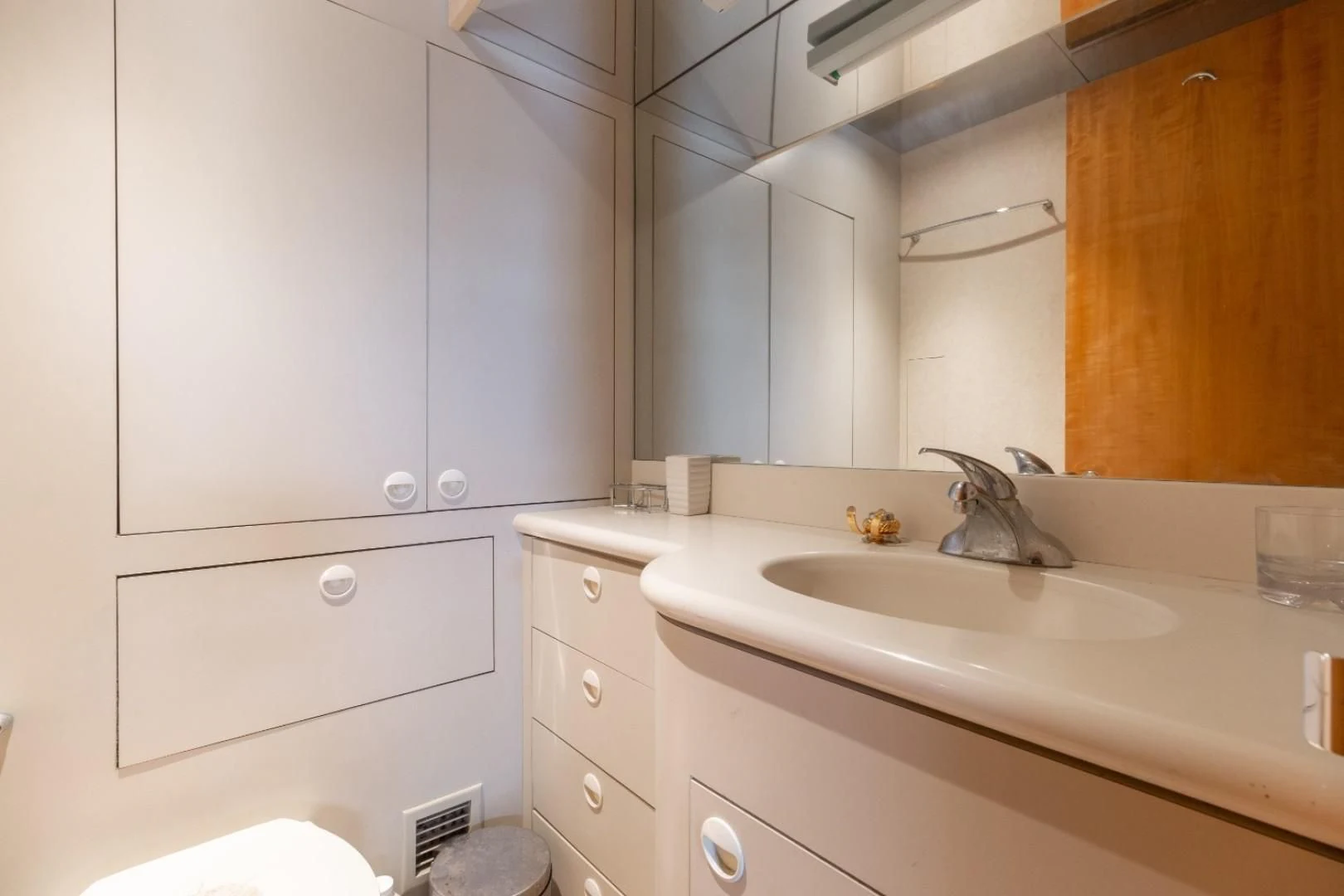 a bathroom with white cabinets aboard CARPE DIEM Yacht for Charter