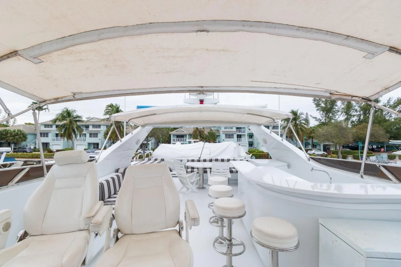 a large white tent with chairs and tables outside aboard CARPE DIEM Yacht for Charter