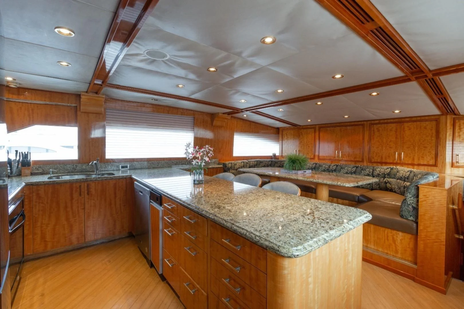 a large kitchen with wooden cabinets aboard CARPE DIEM Yacht for Charter