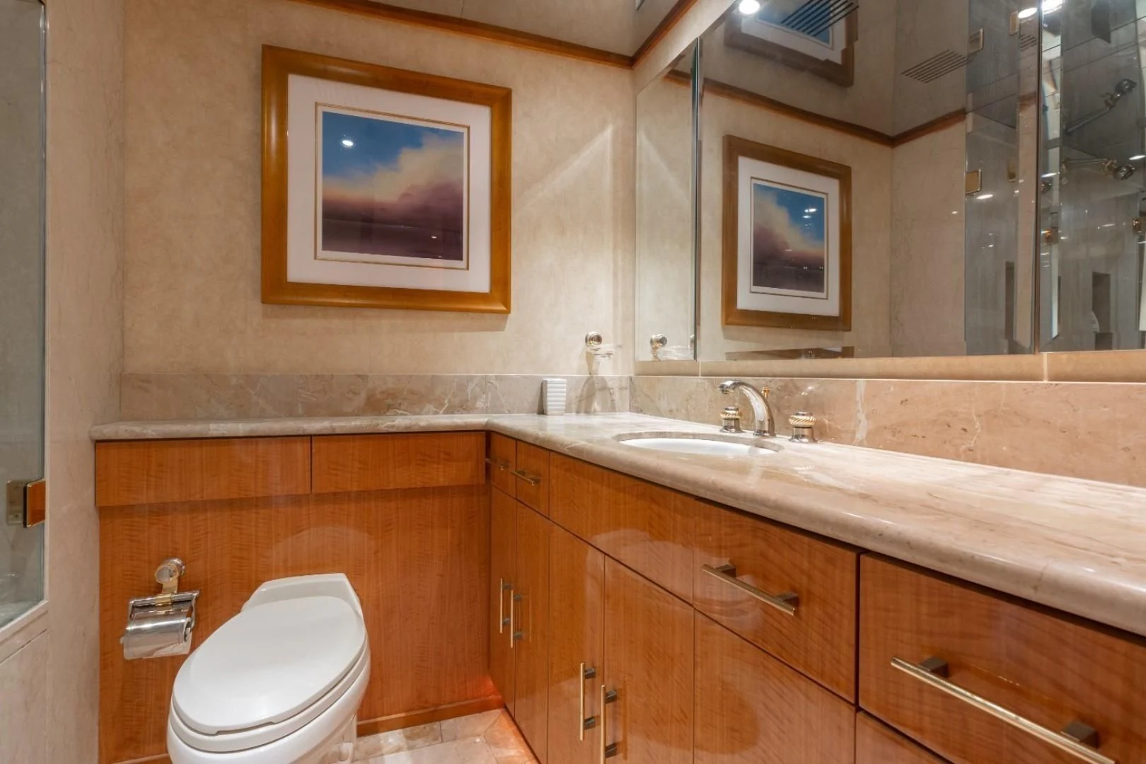 a bathroom with a toilet and a sink aboard CARPE DIEM Yacht for Charter
