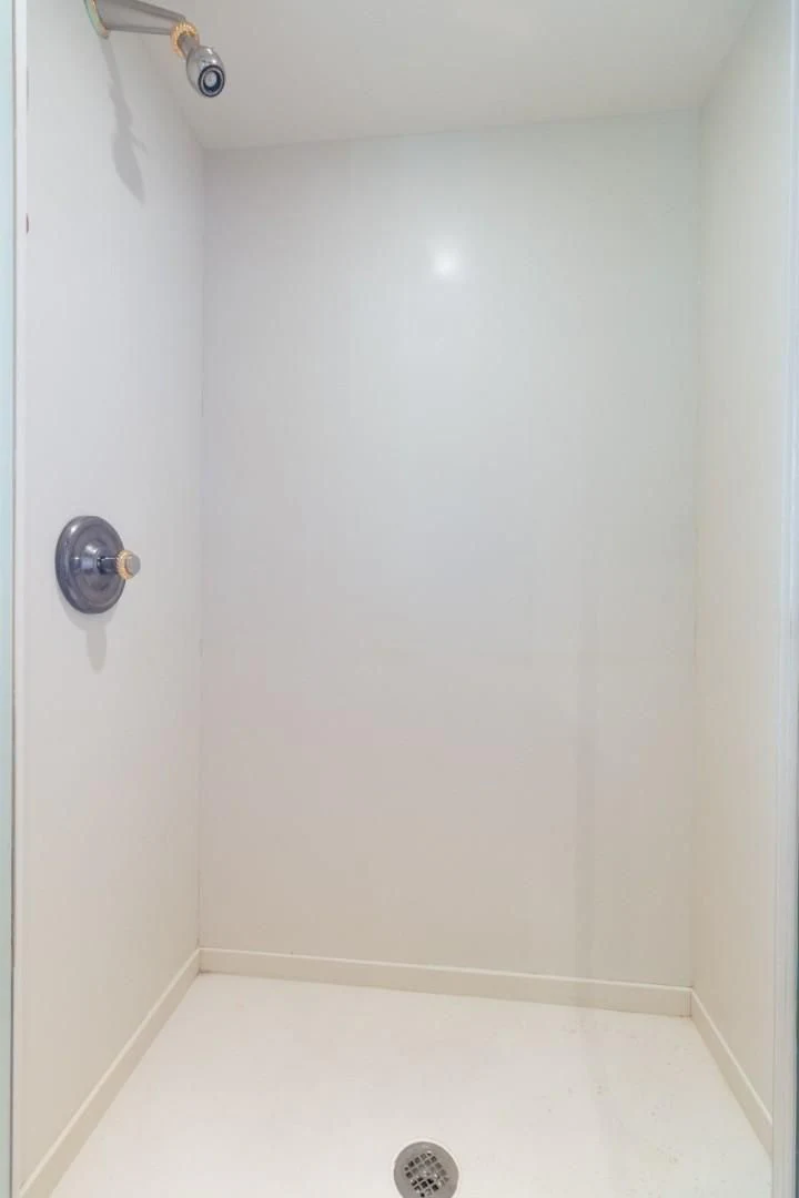 a white door with a handle aboard CARPE DIEM Yacht for Charter