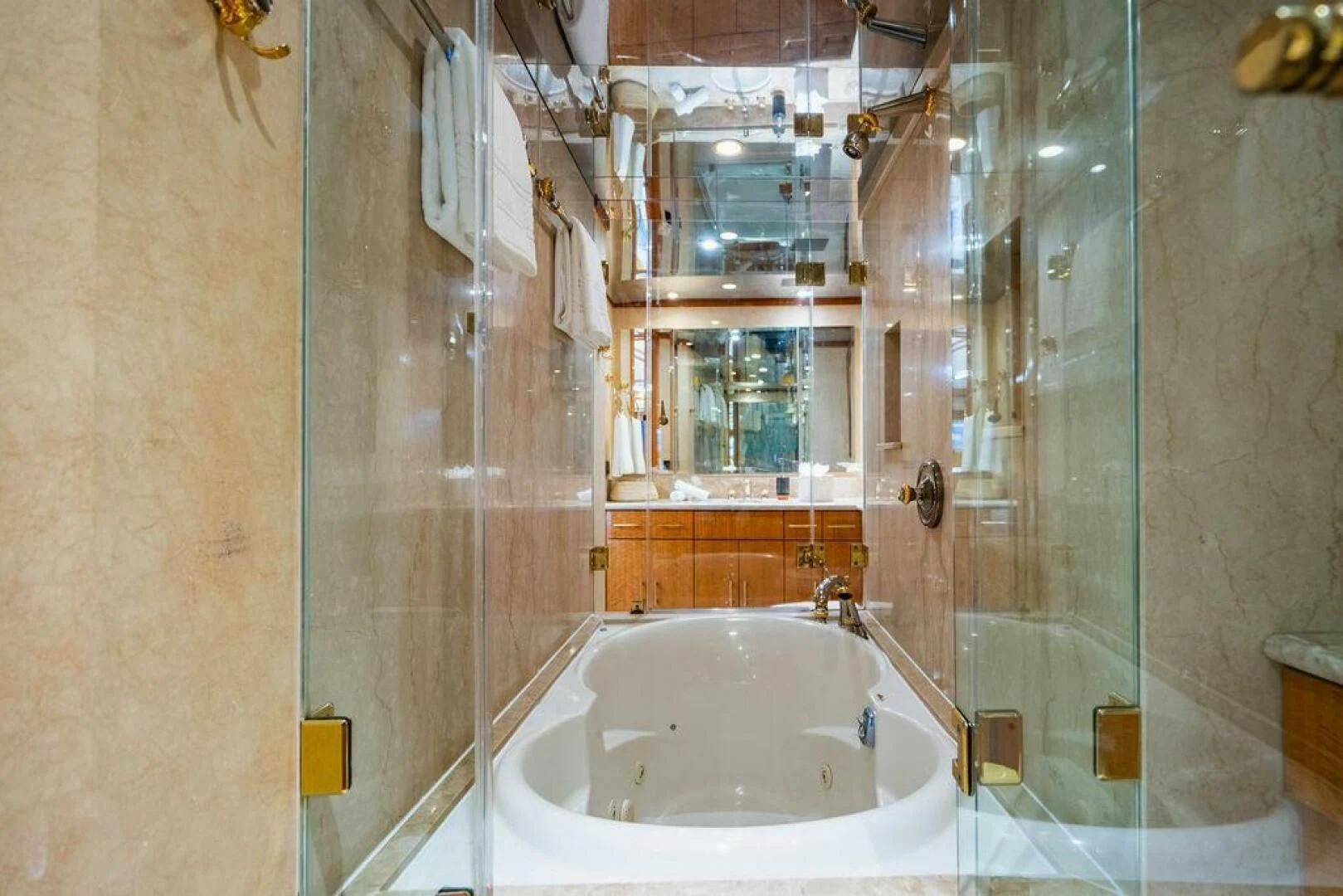 a bathroom with a bathtub and shower aboard CARPE DIEM Yacht for Charter