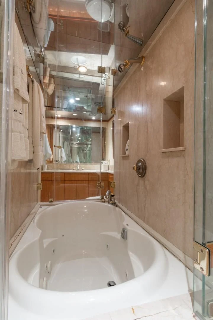 a bathroom with a large bathtub aboard CARPE DIEM Yacht for Charter