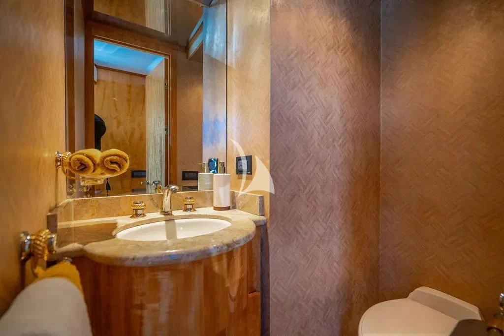 a bathroom with a sink and a mirror aboard CARPE DIEM Yacht for Charter