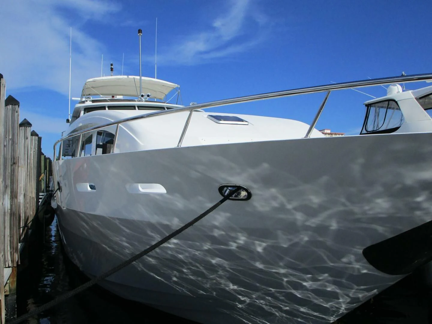 a white boat docked aboard CARPE DIEM Yacht for Charter
