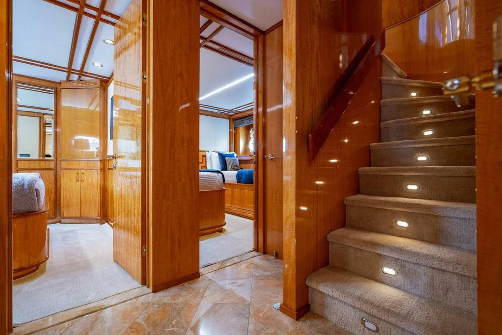 a room with wooden stairs aboard CARPE DIEM Yacht for Charter