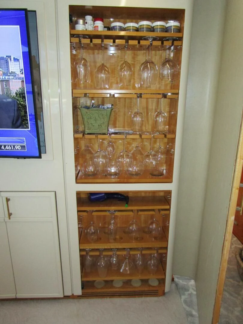 a cabinet with many glasses and bottles on it aboard CARPE DIEM Yacht for Charter