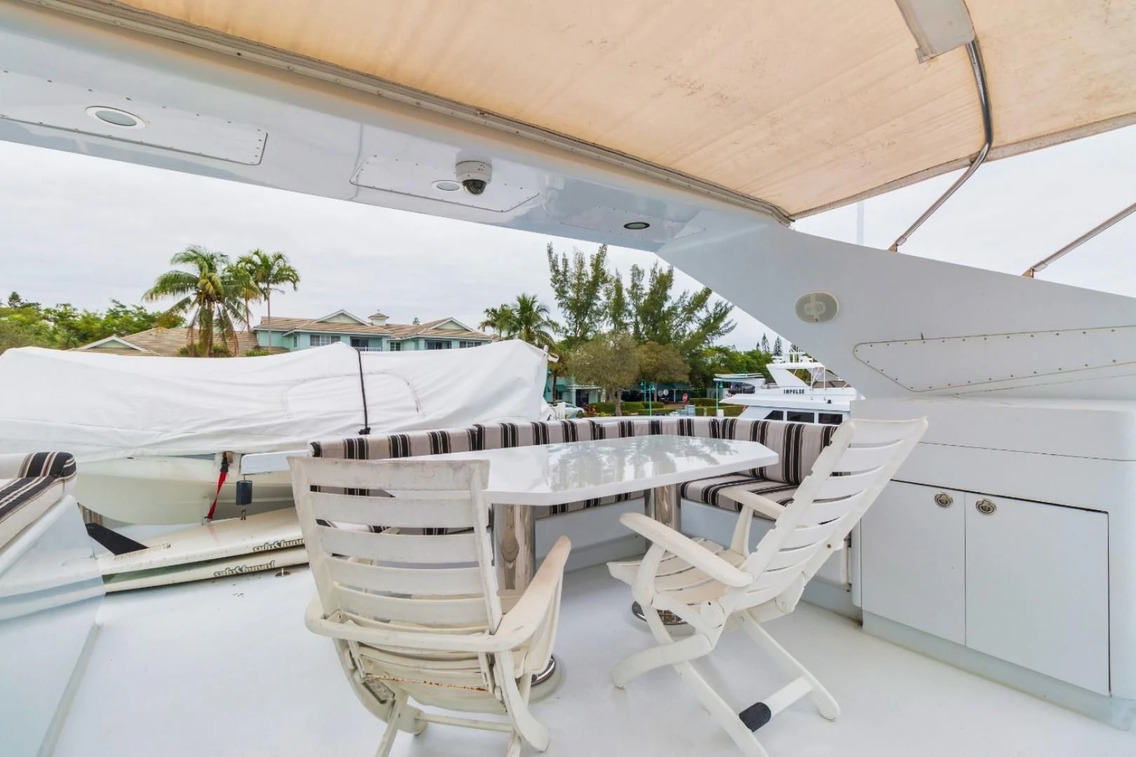 a group of white chairs under a tent aboard CARPE DIEM Yacht for Charter