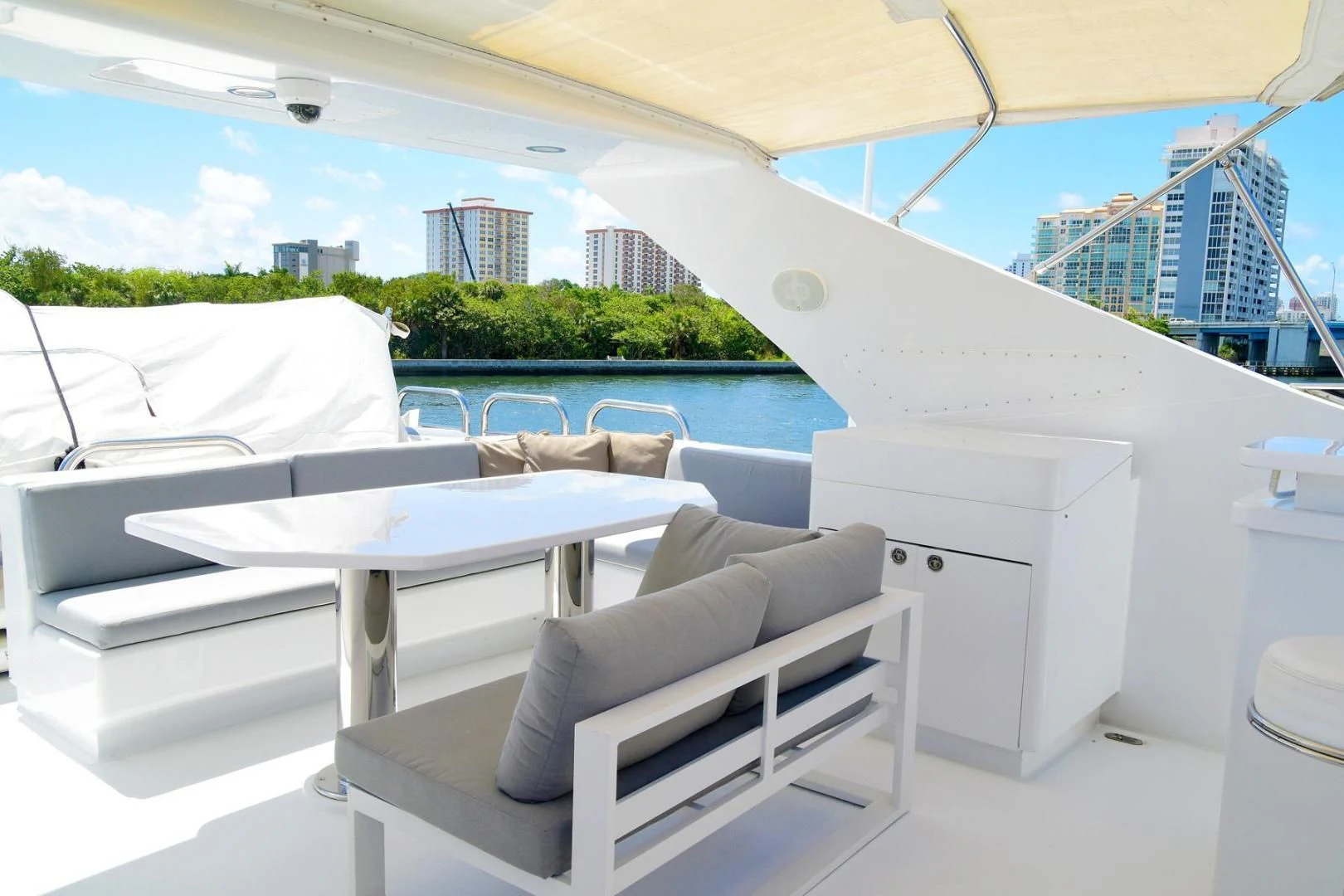 a room with white tables and chairs aboard CARPE DIEM Yacht for Charter