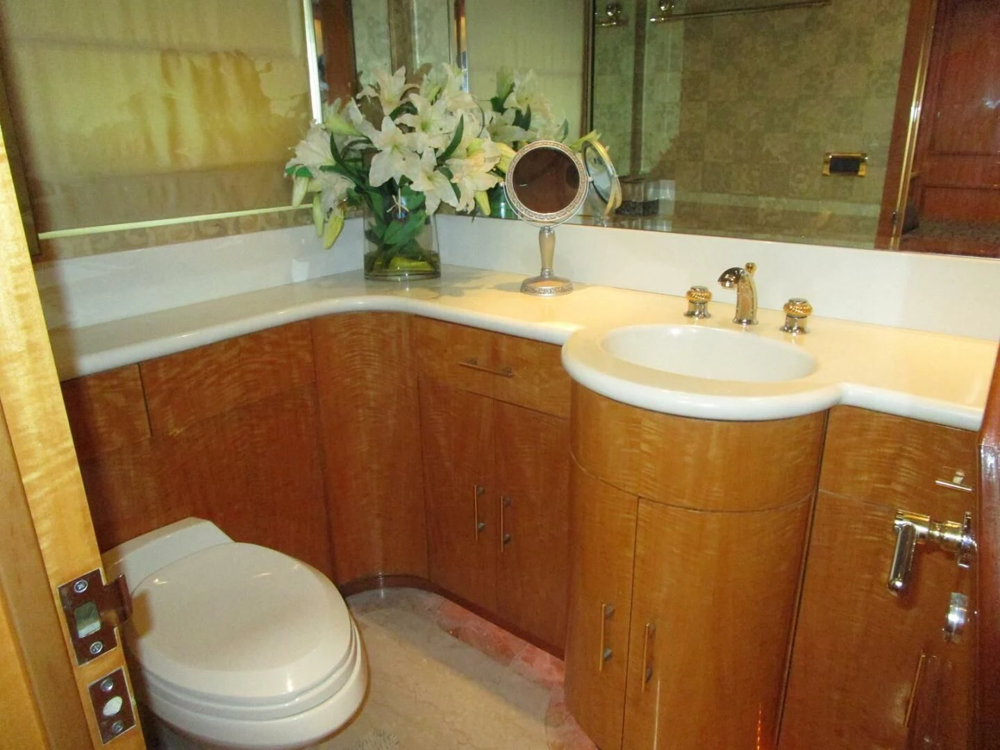 a bathroom with a toilet and a sink aboard CARPE DIEM Yacht for Charter
