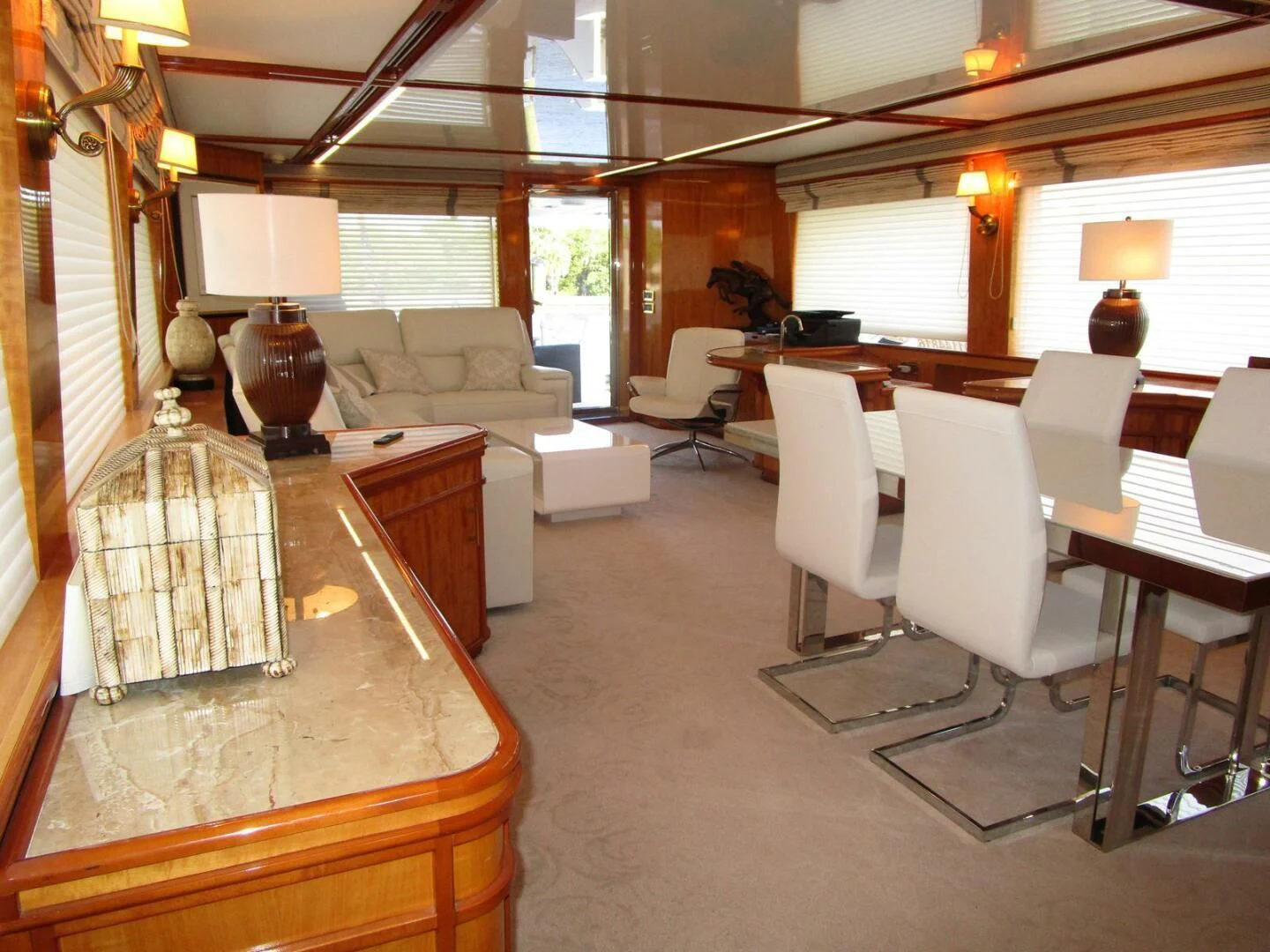 a living room with a large window aboard CARPE DIEM Yacht for Charter