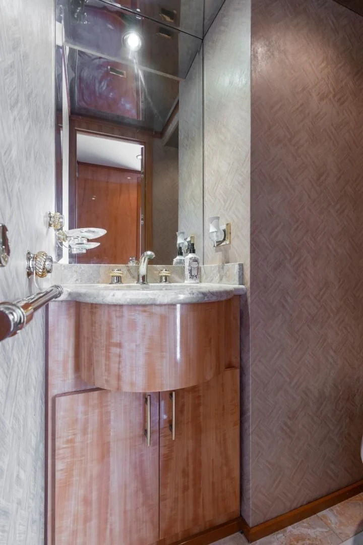 a bathroom with a sink and a mirror aboard CARPE DIEM Yacht for Charter