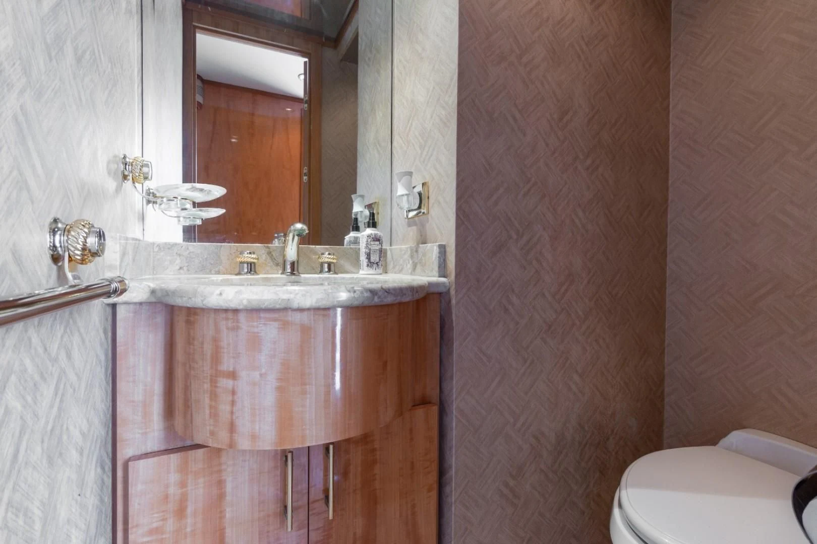 a bathroom with a sink and a toilet aboard CARPE DIEM Yacht for Charter