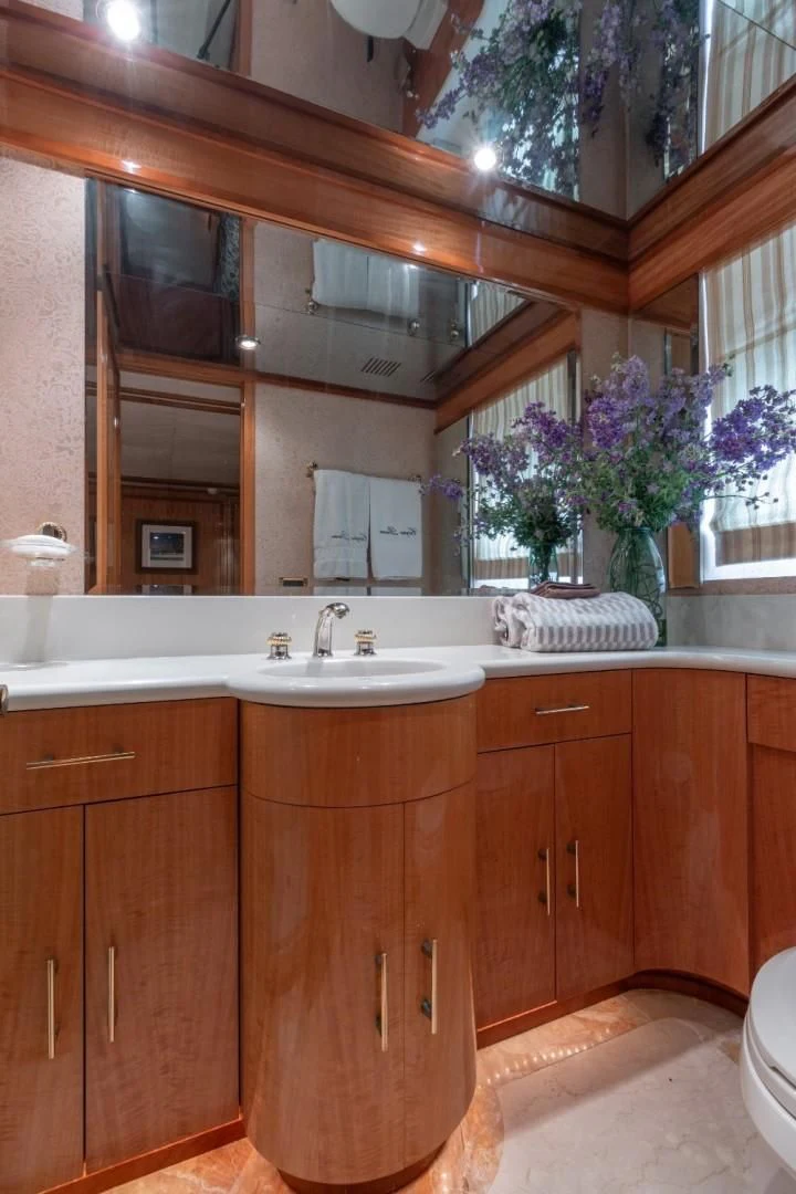 a bathroom with a sink and cabinets aboard CARPE DIEM Yacht for Charter